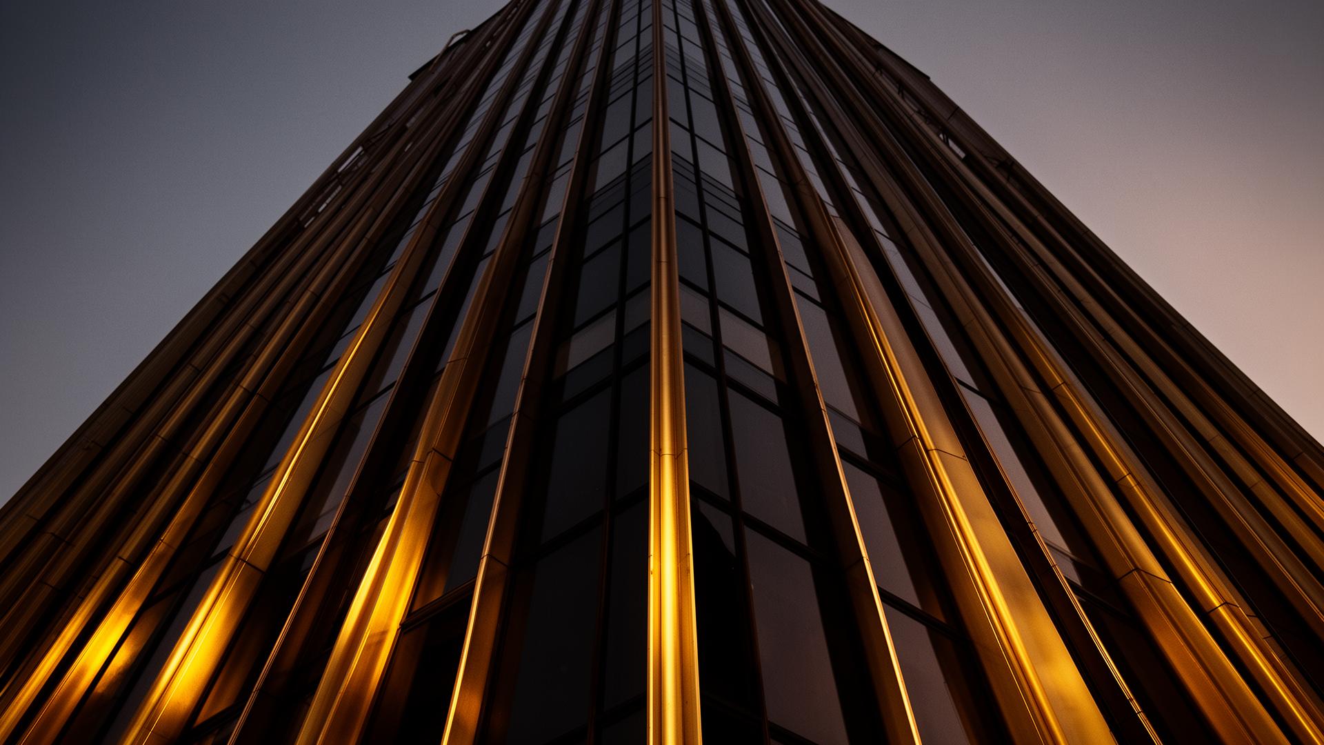 Modern skyscraper facade with brass details